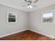 This bedroom features hardwood floors and a ceiling fan and natural light at 2505 Ashford Dr, Newton, NC 28658