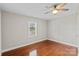 Bedroom with hardwood floors, a ceiling fan, and bright natural light at 2505 Ashford Dr, Newton, NC 28658