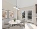 Dining area featuring wood cabinets, doors with view of backyard and stylish pictures at 2505 Ashford Dr, Newton, NC 28658