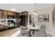 Dining area featuring wood cabinets and table with a marble top at 2505 Ashford Dr, Newton, NC 28658