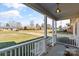 Inviting front porch with white railings and an exterior light fixture at 2505 Ashford Dr, Newton, NC 28658