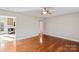 Open living room with hardwood floors and an adjoining kitchen area at 2505 Ashford Dr, Newton, NC 28658