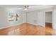 Bright living room features hardwood floors, a ceiling fan, and neutral walls at 2505 Ashford Dr, Newton, NC 28658