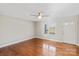 Bright, empty living room with hardwood floors and a ceiling fan at 2505 Ashford Dr, Newton, NC 28658