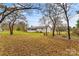 Large backyard with mature trees and open grassy area at 4264 C & B Farm Rd, Conover, NC 28613