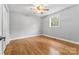 Bright bedroom with hardwood floors and ceiling fan at 4264 C & B Farm Rd, Conover, NC 28613