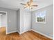 Well-lit bedroom with hardwood floors and ceiling fan at 4264 C & B Farm Rd, Conover, NC 28613