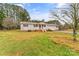 Ranch home with carport, covered porch, and spacious yard at 4264 C & B Farm Rd, Conover, NC 28613