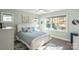 Spacious bedroom with large window and soft blue bedding at 4779 Looking Glass Trl, Denver, NC 28037