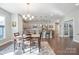 Kitchen and dining area with hardwood floors and modern lighting at 4779 Looking Glass Trl, Denver, NC 28037