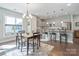 Kitchen and dining area with hardwood floors and modern lighting at 4779 Looking Glass Trl, Denver, NC 28037