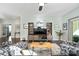 Relaxing living room, featuring built-in shelving and large TV at 4779 Looking Glass Trl, Denver, NC 28037