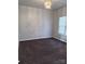 Carpeted bedroom with neutral walls and a window at 5846 Hanna Ct, Charlotte, NC 28212