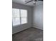 Bright bedroom with large windows and ceiling fan at 5846 Hanna Ct, Charlotte, NC 28212