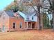 Brick house with a covered porch and large yard at 5846 Hanna Ct, Charlotte, NC 28212