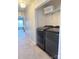 Laundry room with washer, dryer, and overhead shelving at 5846 Hanna Ct, Charlotte, NC 28212