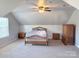 Spacious main bedroom with wood furniture and a ceiling fan at 5846 Hanna Ct, Charlotte, NC 28212