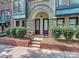 Townhome entry featuring double doors and a brick walkway at 658 E 10Th St, Charlotte, NC 28202