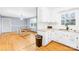 Kitchen with white cabinets, stainless steel sink, and stove at 7006 Penndale Dr, Shelby, NC 28152