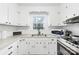 Kitchen with white cabinets and stainless steel appliances at 7006 Penndale Dr, Shelby, NC 28152