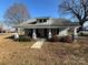 Charming home with a covered front porch, perfect for enjoying quiet mornings and evenings at 105 Beaver St, China Grove, NC 28023