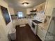 Bright kitchen featuring white cabinets, a stylish backsplash, and modern appliances at 105 Beaver St, China Grove, NC 28023