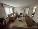 Cozy living room featuring carpet, a fireplace, and neutral paint at 105 Beaver St, China Grove, NC 28023