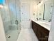 Bathroom with double vanity, marble flooring, and a large shower at 166 Fulworth Nw Dr # 67, Concord, NC 28027