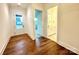 Bright entryway with hardwood floors and access to a half-bath at 166 Fulworth Nw Dr # 67, Concord, NC 28027