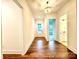 Elegant hallway with hardwood floors and access to multiple rooms at 166 Fulworth Nw Dr # 67, Concord, NC 28027