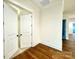 Bright hallway with hardwood floors and access to bedrooms at 166 Fulworth Nw Dr # 67, Concord, NC 28027