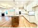 Modern kitchen with white cabinets and a large island at 166 Fulworth Nw Dr # 67, Concord, NC 28027