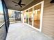 Screened porch with sliding glass doors and ceiling fan at 166 Fulworth Nw Dr # 67, Concord, NC 28027