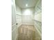 Large walk-in closet with wire shelving and carpeting at 166 Fulworth Nw Dr # 67, Concord, NC 28027