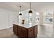 Spacious kitchen island with pendant lighting perfect for food prep, dining, and entertaining at 18024 Wilbanks Dr, Charlotte, NC 28278