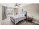 Cozy bedroom with window, ceiling fan and rocking chair at 1811 Robbins Meadows Dr, Waxhaw, NC 28173