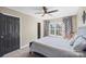 Charming bedroom with window, ceiling fan and closet at 1811 Robbins Meadows Dr, Waxhaw, NC 28173