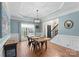 Dining room with light blue walls and a wood table at 1811 Robbins Meadows Dr, Waxhaw, NC 28173