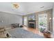 Spacious Gathering room featuring a fireplace and built-in shelving at 1811 Robbins Meadows Dr, Waxhaw, NC 28173