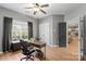 Bright home office with built-in desk and window views at 1811 Robbins Meadows Dr, Waxhaw, NC 28173