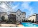 Two-story house with attached deck and a refreshing in-ground pool at 1811 Robbins Meadows Dr, Waxhaw, NC 28173