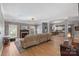 Spacious living room with a stone fireplace and kitchen view at 1811 Robbins Meadows Dr, Waxhaw, NC 28173