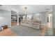 Bright living room with hardwood floors and view into kitchen at 1811 Robbins Meadows Dr, Waxhaw, NC 28173