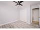 Bright bedroom featuring vinyl floors, ceiling fan, and neutral walls at 588 Blossom Hill Rd, Lincolnton, NC 28092