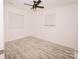 Bright bedroom featuring vinyl floors, ceiling fan, and neutral walls at 588 Blossom Hill Rd, Lincolnton, NC 28092