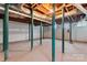 Unfinished basement with high ceilings and support columns at 610 Crescent Cir, Kings Mountain, NC 28086