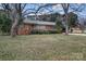 Brick ranch house with mature trees and a large front yard at 610 Crescent Cir, Kings Mountain, NC 28086