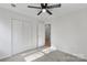 This bedroom features neutral walls, carpeted floors, and a ceiling fan at 6707 Brachnell View Dr, Charlotte, NC 28269