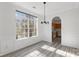 A dining room with lots of light and an archway through to the kitchen at 6707 Brachnell View Dr, Charlotte, NC 28269