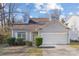 Charming home with dormer windows, manicured bushes and a two-car garage at 6707 Brachnell View Dr, Charlotte, NC 28269